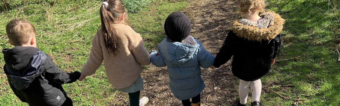 Photo: children learning outdoors at Kiddlywinks Nursery, Penrith